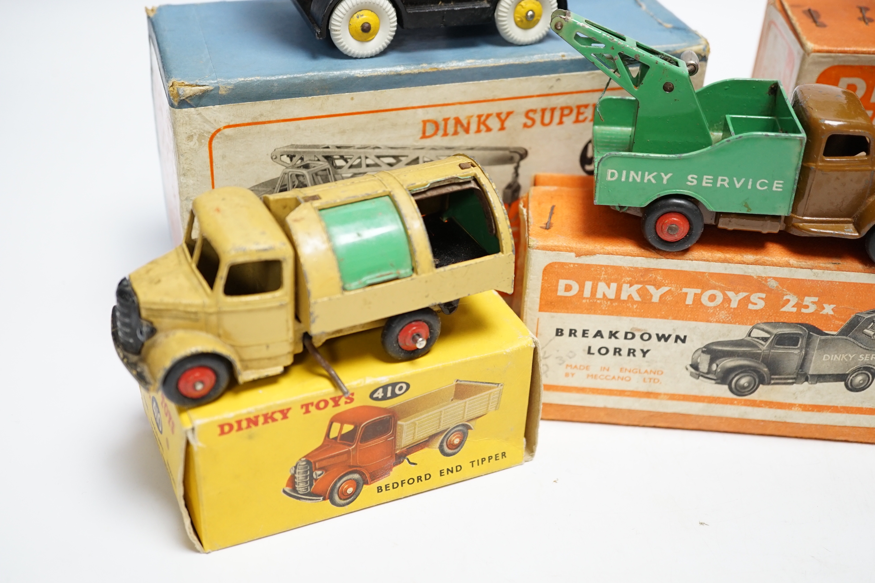 Five boxed dinky toys including (25x) breakdown lorry, (410) Bedford End Tipper, (555) Fire Engine, (571) Coles Mobile Crane, and (14c) Coventry Climax Fork Lift Truck